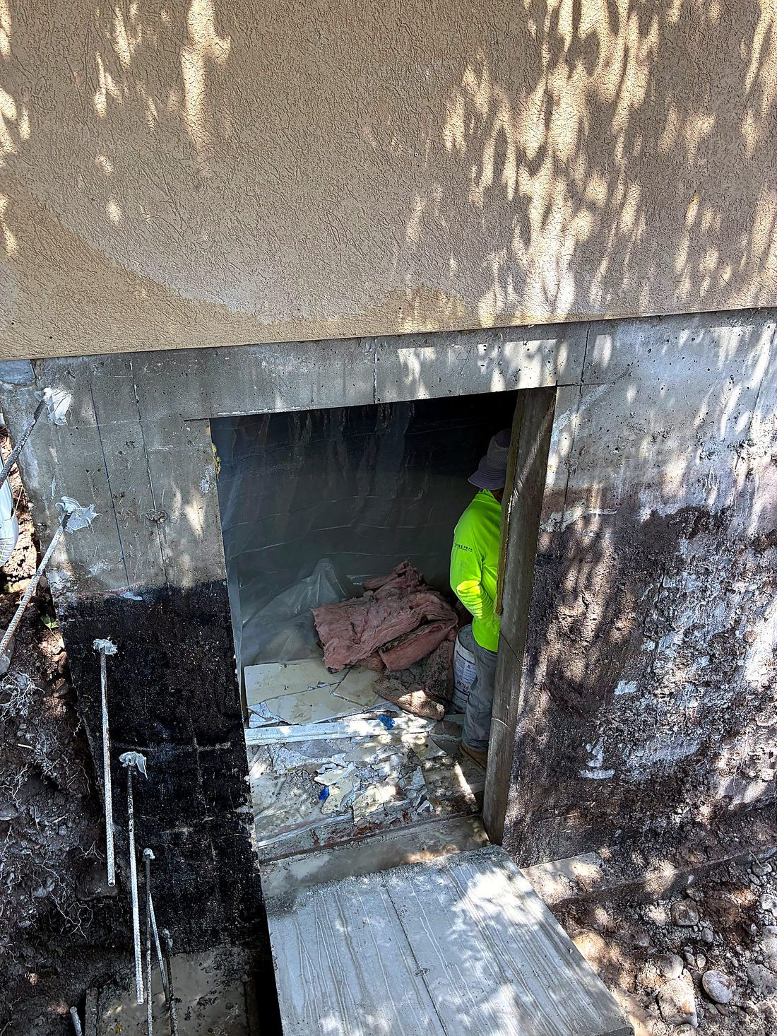 New door opening cut into a concrete basement wall